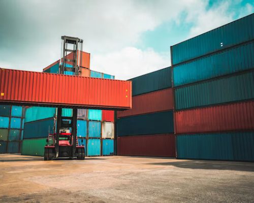 cargo-container-overseas-shipping-shipyard-with-heavy-machine_31965-51794_converted